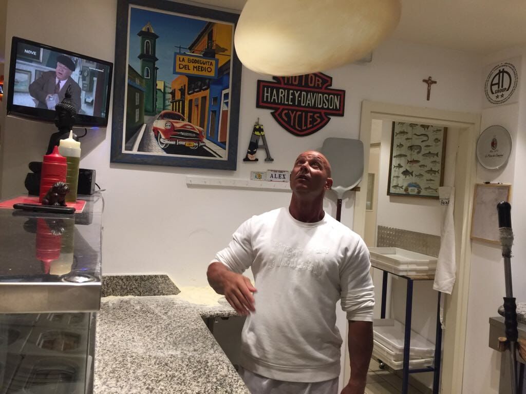 Chef tossing pizza