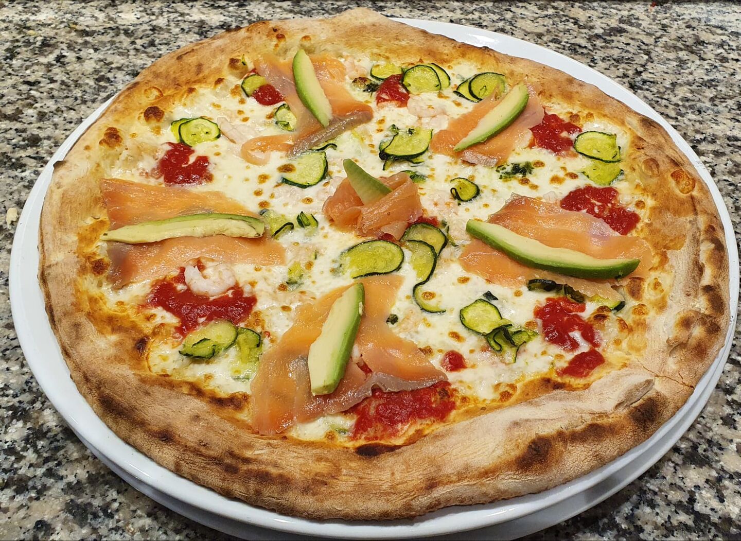 Pizza with salmon and avocado